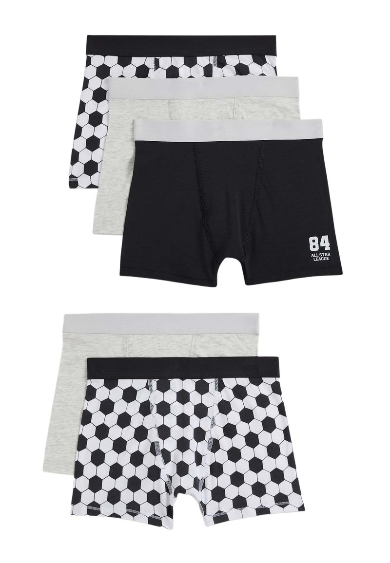 Conjunto de cuatro calzoncillos tipo boxer para niños: uno con un patrón hexagonal en blanco y negro, y tres en colores sólidos—negro, gris y gris oscuro—con cinturillas en contraste.