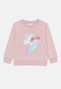 Felpa rosa con un design di unicorno, dotato di criniera blu, corno dorato e un fiocco rosa chiaro. Tessuto morbido con polsini e orlo a coste.