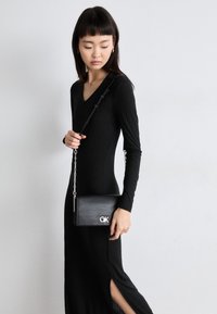 CONVERTIBLE MINI BAG - Borsa a tracolla - black