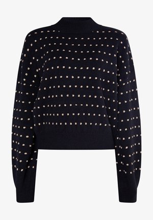 Navy knitted sweater with a high crew neckline and cropped fit. Features textured gold and cream polka dots throughout. Long sleeves.