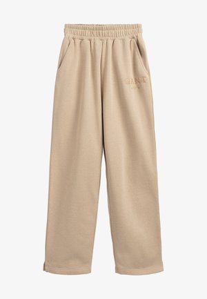 Beige sweatpants med elastisk talje, sidelommer og subtilt "GANT"-logo broderet på den øverste venstre ben.