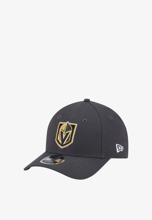 Black New Era cap with curved brim, featuring a gold and white knight helmet emblem on front and brand logo on side.