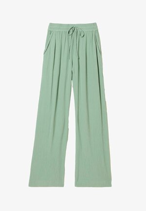 Bukser med vide ben i lysegrønt krøllet stof med elastik i taljen, snørrejustering og sidelommer. Blød tekstur, afslappet pasform.