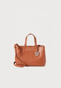 Brown embossed leather handbag featuring double handles, an adjustable shoulder strap, and a decorative charm with logo detail.