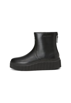 Schwarze Knöchelstiefel aus glattem Leder mit einer dicken, gerippten Plateausohle und einem Reißverschluss an der Seite. Minimalistisches Design, keine sichtbaren Muster.