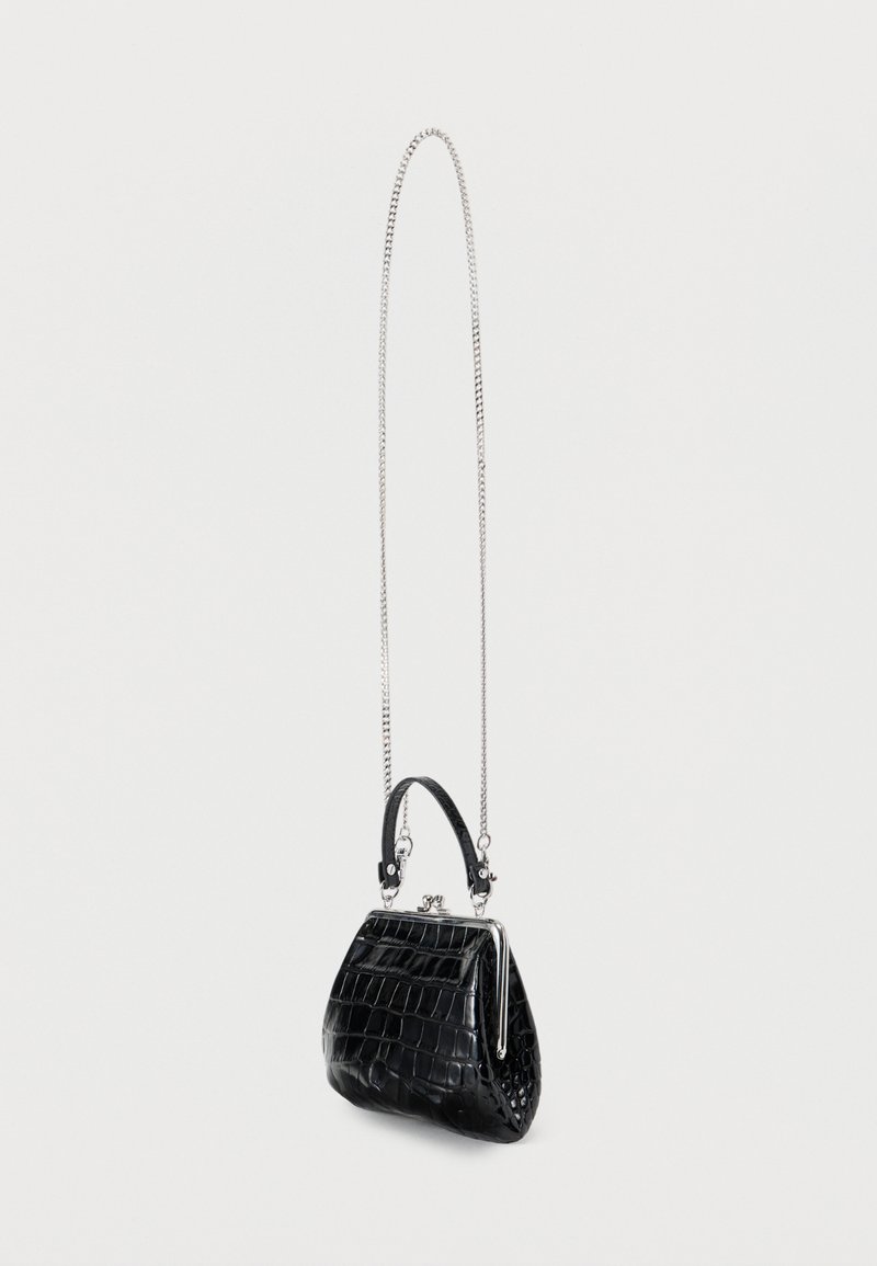 Black faux crocodile leather handbag with a silver chain strap, rounded shape, structured design, and a small top handle.
