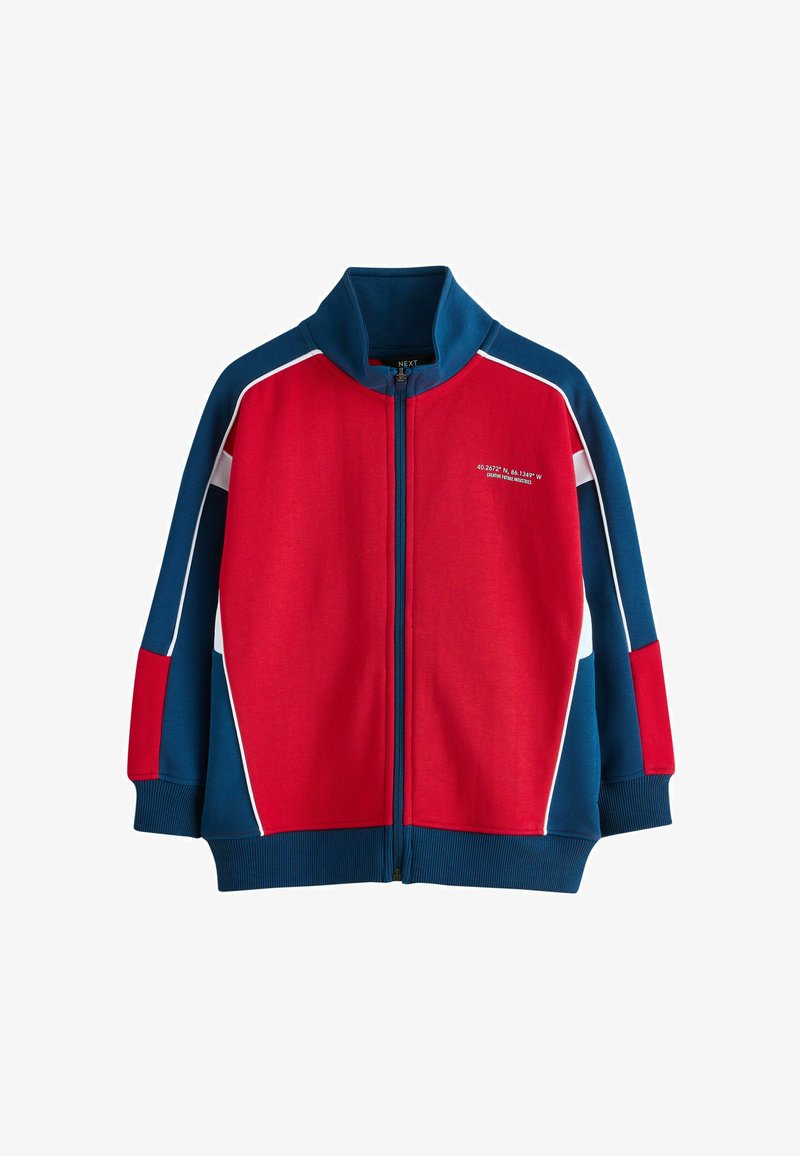 Laste lukuga jakk punase esiosaga, siniste varrukate ja kraega, valge ääristusega ning vasakul rinnal väikese valge kirjaga.