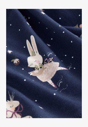 Navy fabric featuring whimsical illustrations of a bunny in a dress and unicorns, adorned with stars and snowflakes. Soft, textured material.