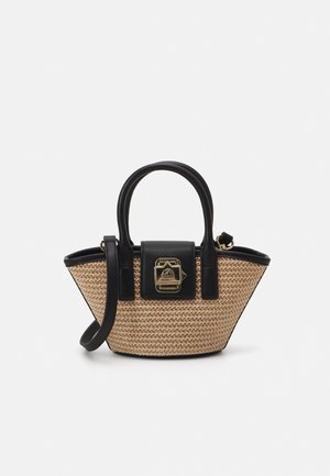 Woven straw handbag with black leather handles, a structured shape, and gold hardware accents. Features a fold-over closure and removable strap.
