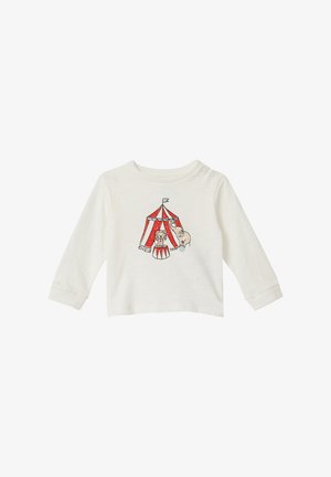 Weißes Langarm-Babyshirt mit rotem und weißem Zirkuszelt, Löwen auf einem Sockel und Elefant-Grafik auf der Vorderseite.