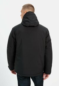 Black insulated jacket with a hood, featuring a smooth texture, fitted design, and elastic cuffs. Back view shows shoulder seams.