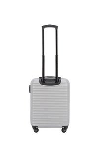 Compact silver suitcase with textured stripe design, black retractable handle, and four wheels for mobility. Top carrying handle included.