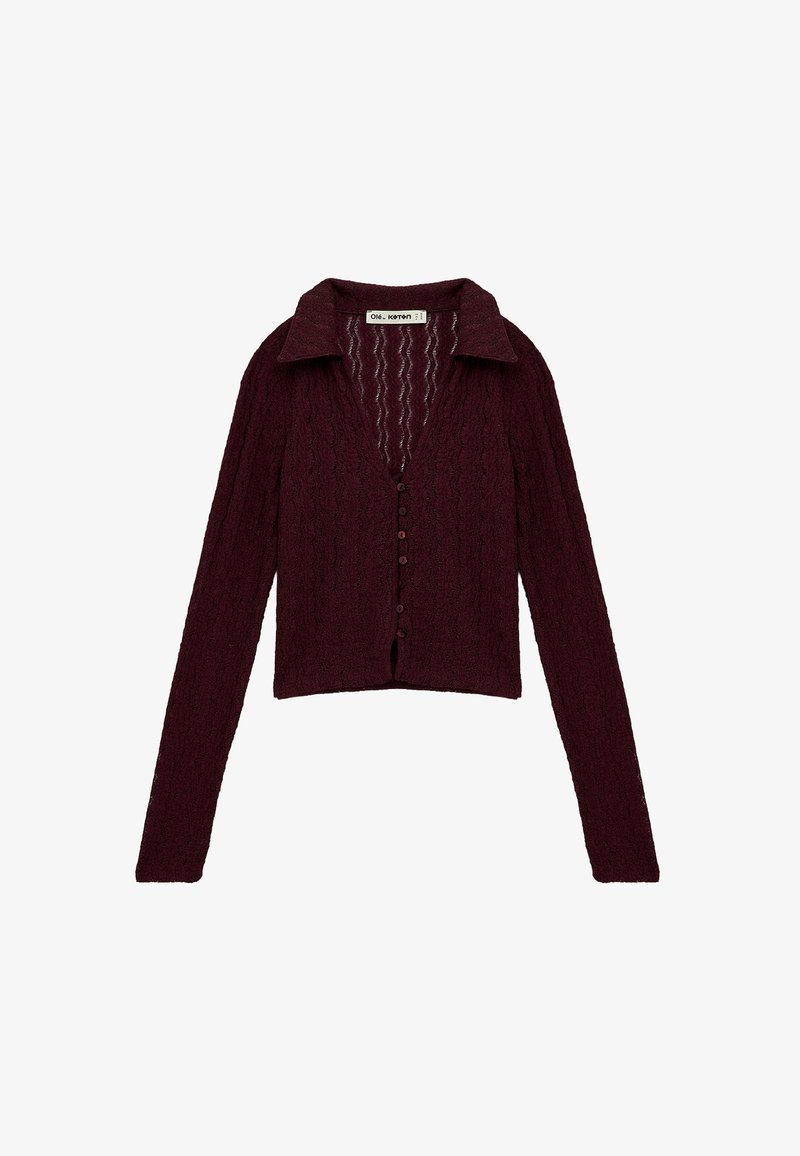 Burgundy knitted cardigan with a collared neckline, front buttons, and long sleeves. Features a textured pattern throughout the fabric.