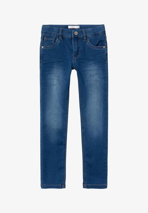 Mėlyni džinsai su siauru pjūviu, su mygtukų užsegimu, penkių kišenių dizainu ir subtiliu audinio blukimu.