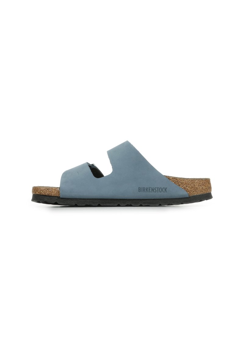 Birkenstock sandal in soft blue, featuring a cork footbed, two cutout straps, and a textured black rubber sole.