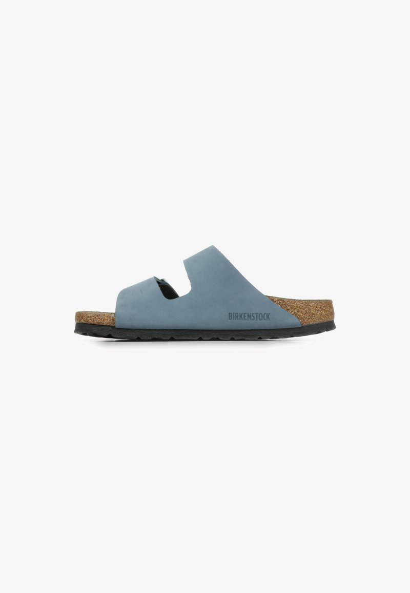 Birkenstock sandal in soft blue, featuring a cork footbed, two cutout straps, and a textured black rubber sole.