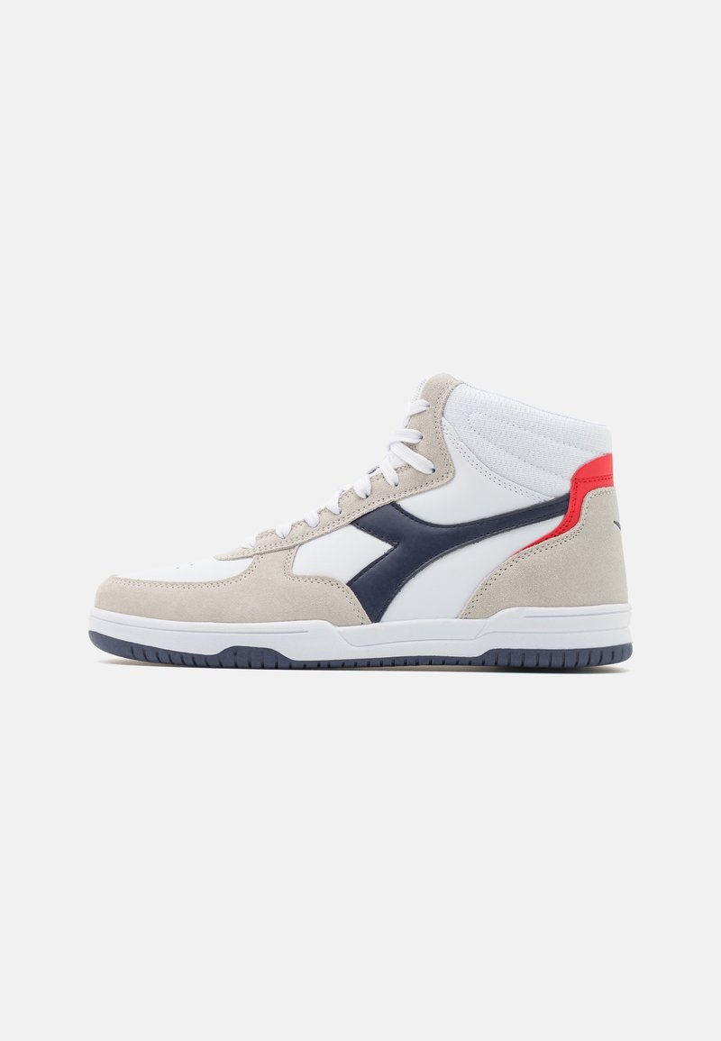High-top sneakers featuring white leather and beige suede, navy accents, and a red heel tab. Textured upper with traditional lacing.