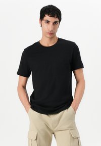 Tommy Jeans OTIS HERRINGBONE PANTS - Cargo trousers - silt
