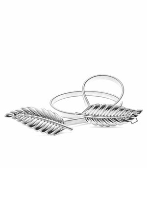 Deux barrettes argentées en forme de feuille avec des bandes flexibles sur fond blanc.