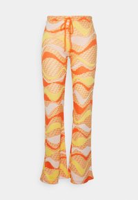 Calças flare de malha com um padrão ondulado em laranja, amarelo e creme. Apresentam uma cinta com cordão e um tecido texturizado.