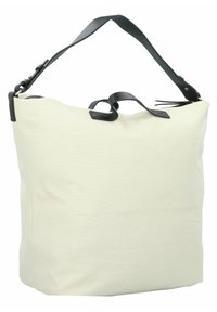 Canvas tote bag in off-white with a black leather strap, featuring a zip closure and top handle for versatility in carrying.