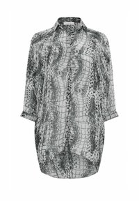 Koszula w czarno-białym wzorze w węża, wykonana z lekkiego materiału. Posiada kołnierzyk, zapięcie na guziki oraz długie rękawy z podwiniętymi mankietami.