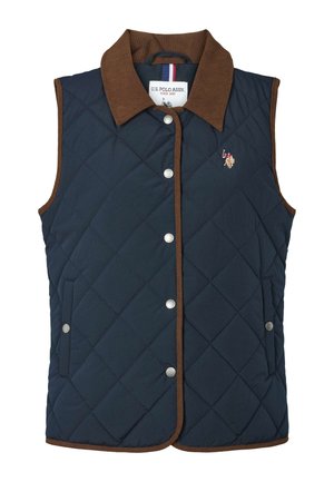 Prešívaná námornícka vesta s hnedým manžetovým golierom z kordoviny, striebornými cvokmi a bočnými vreckami. Na hrudi je vyšívané logo.