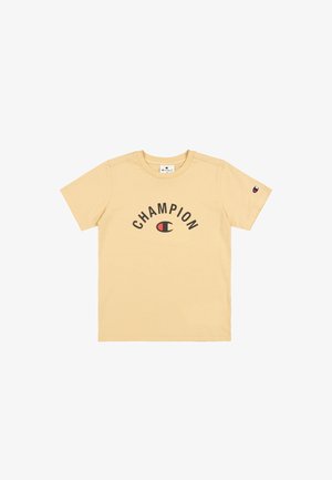 T-shirt giallo in cotone con logo "CHAMPION" nero e dettagli rossi, colletto tondo, maniche corte e un piccolo logo sulla manica.