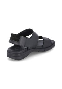 Zwarte leren sandalen met verstelbare banden, een gestructureerde voetbed en een dikke rubberen zool voor comfort. Open achterkant ontwerp voor gemakkelijke aan- en uittrekken.