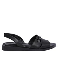 Zwarte leren sandaal met twee gekruiste banden en een slingback. Heeft een platte zool en hartvormige accenten op de banden.