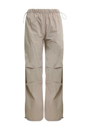 Beige, lightweight, loose-fitting pants with an elastic waistband and drawstring. Features large side pockets and tapered cuffs.