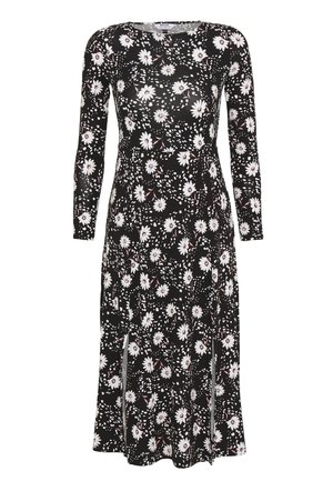Vestito midi nero con maniche lunghe con stampa floreale di margherite bianche e spacchi frontali.