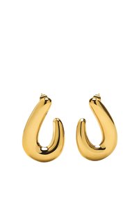 Złote kolczyki w kształcie obręczy o gładkim, zakrzywionym wzorze. Posiadają błyszczące wykończenie i zwężający się kształt, podkreślający ich unikalną sylwetkę.