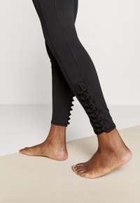Puma STUDIO TREND - Leggings - black