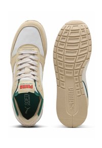 Beige and white athletic shoes with mesh and suede materials, featuring green accents, a textured rubber sole, and lace-up design.