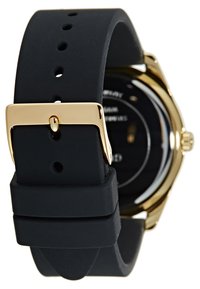 Bracelet de montre en silicone noir avec boucle en métal doré et passant, doté d'une texture lisse et de trous de taille ajustables.