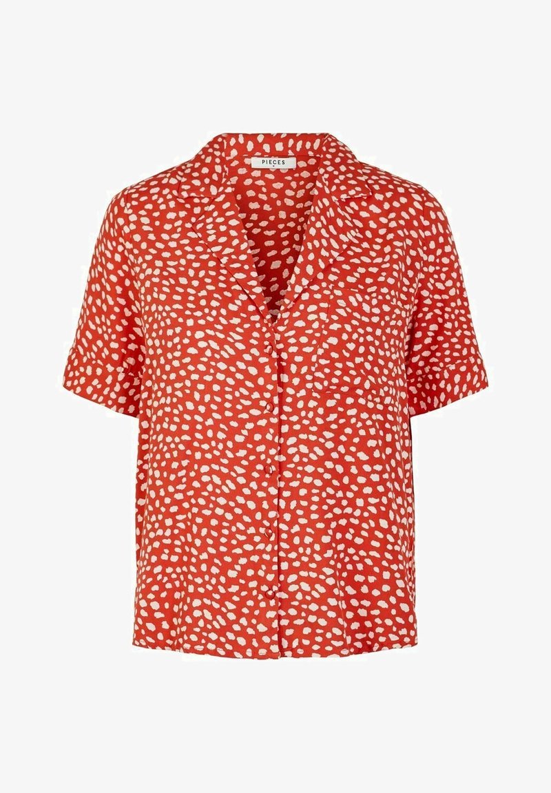 Blouse rouge courte à manches courtes avec motif de points blancs irréguliers et petit col de la marque Pieces.