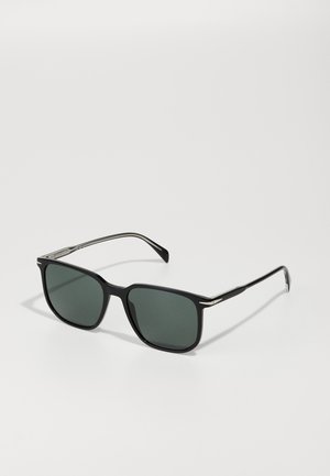 Square sunglasses with black plastic frame, dark green lenses, and silver accents on the temples. Glossy finish and sleek design.