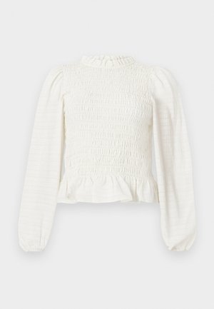 Weißes Langarmoberteil mit gerafftem Design, hohem Kragen und Rüschensaum. Strukturierter Stoff mit Raffung an den Ärmeln.