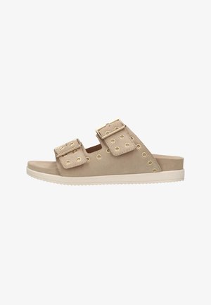 Beige suede slide sandals feature two wide straps with gold-tone hardware and perforations, set on a white cushioned sole.