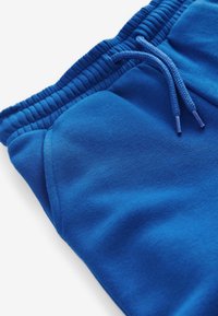 Next SLIM FIT CUFFED JOGGERS - Verryttelyhousut - blue