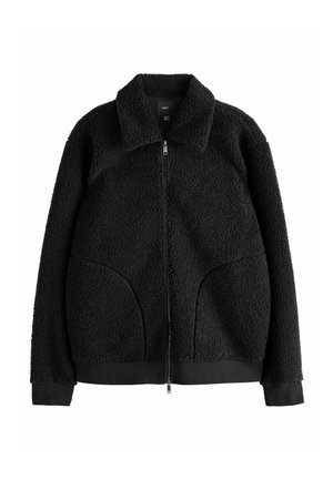 Black fleece jacket with a textured surface, zip closure, and a collar. Features large front pockets and ribbed cuffs and hem.