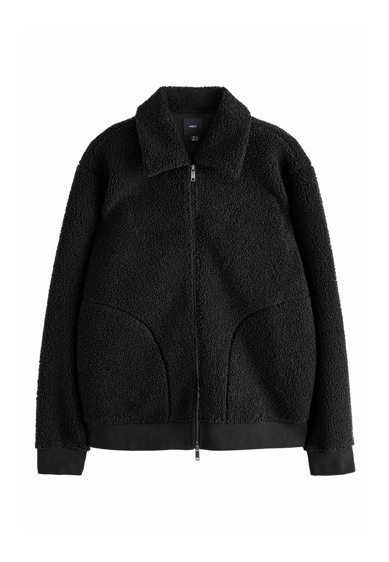 Veste en polaire noire avec col, fermeture éclair intégrale, poches latérales, tissu texturé et poignets et ourlet côtelés. Design décontracté pour la chaleur.