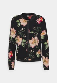 Veste bomber noire à motifs floraux roses et verts, avec poignets et ourlet côtelés, fermeture éclair frontale. Tissu léger.