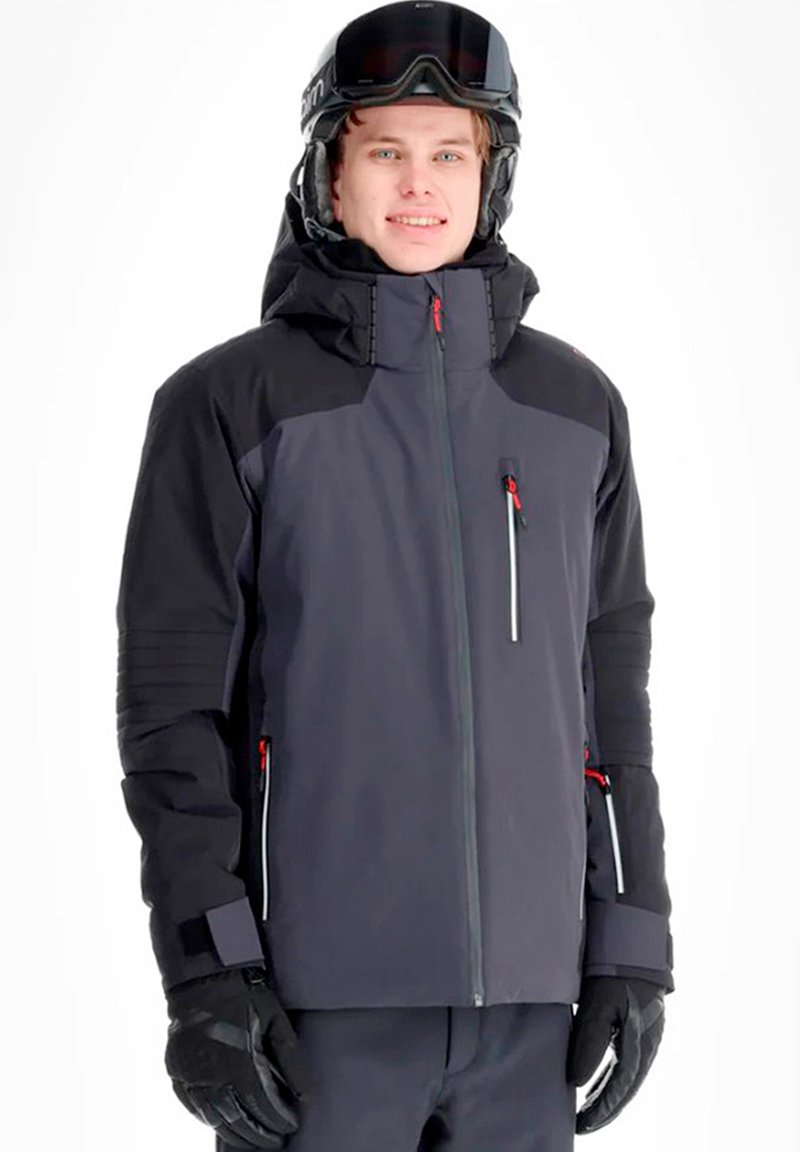 Giacca da sci impermeabile da uomo di colore grigio scuro con dettagli neri, tasche con cerniera e cappuccio, completata da guanti neri e casco.