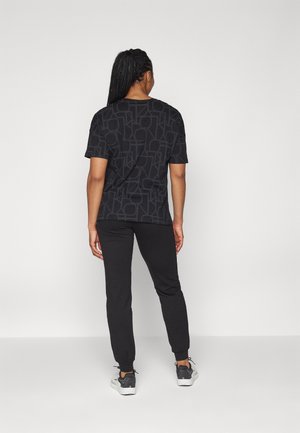 Pantalones deportivos - black