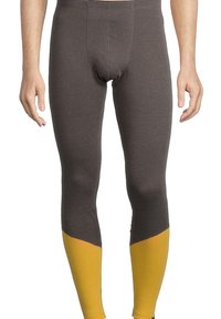 Heren thermoleggings in donkergrijs met een aansluitend ontwerp, voorzien van gele mesh-accenten op de onderbenen voor extra ventilatie.