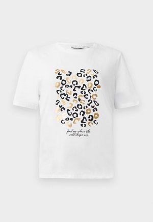 White t-shirt with a leopard print design in black and gold, featuring a text detail that reads, "find me where the wild things are."