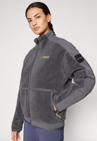 adidas Terrex NATIONAL GEOGRAPHIC JACKET UNISEX - Flísová bunda - grey six