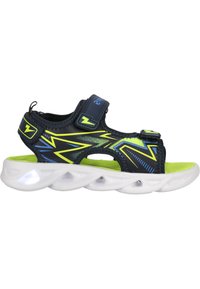 Navy ja neonroheline sandaal reguleeritavate rihmadega, tekstureeritud ülaosa ja valge pehmenduspadjaga tald, mis sisaldab valgustavaid lisandeid.